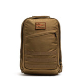 GORUCK brown tactical rucksack backpack with logo patch and MOLLE webbing on white background