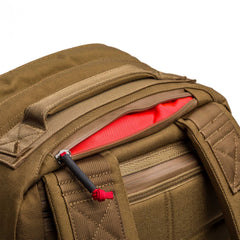 GORUCK coyote brown 26L rucksack detail with red-lined top zip pocket