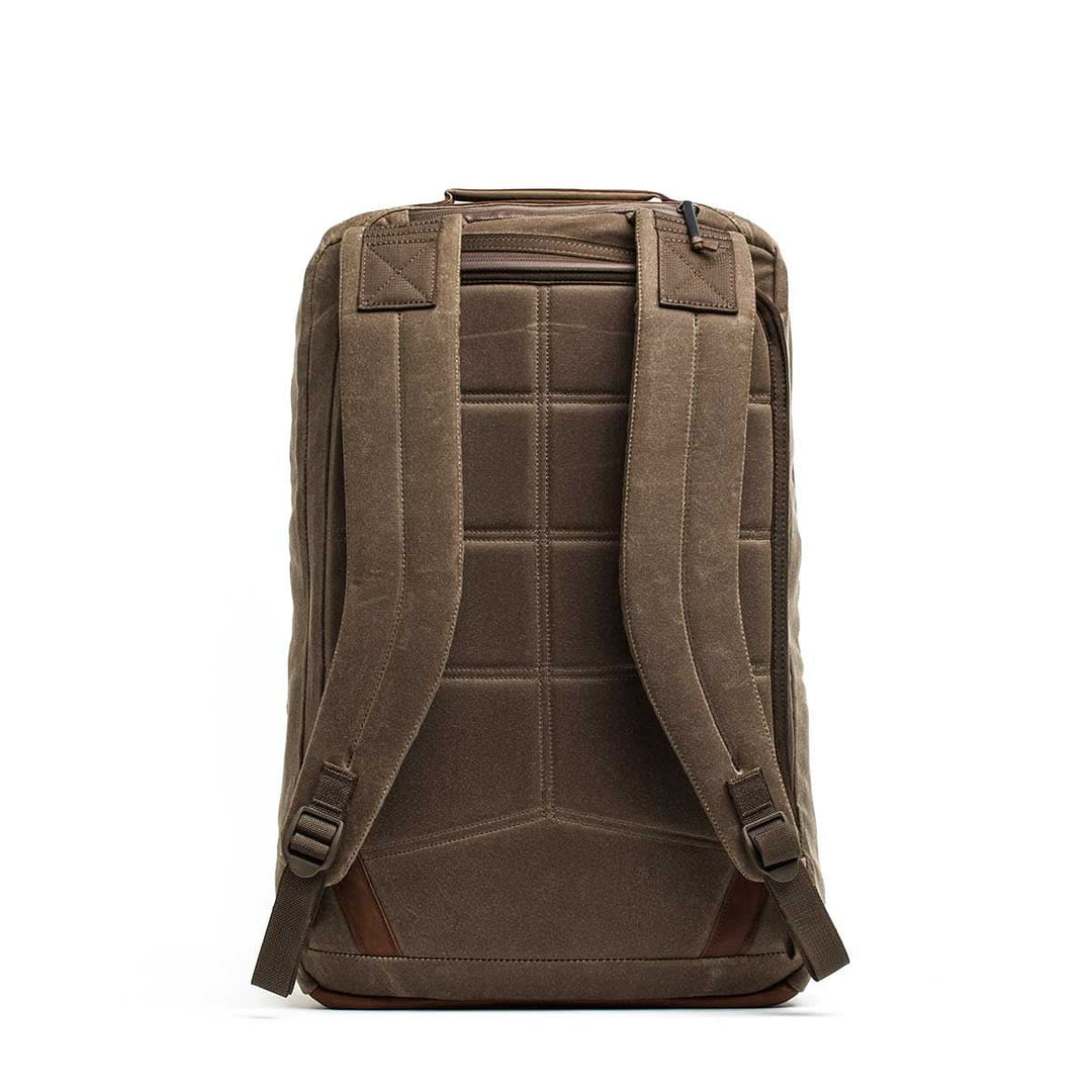 The GORUCK GR2 - Heritage Waxed Canvas backpack is shown from the back, featuring padded straps, paneling, and a top zipper pocket—crafted from durable Waxed Duck Canvas for extra resilience.