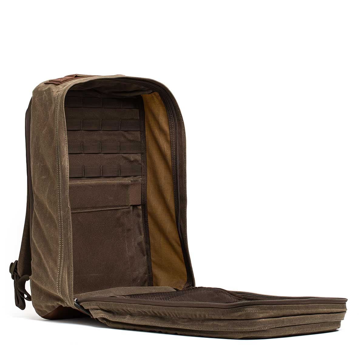 GORUCK Heritage rucksack in dark oak, open to show interior stash pocket and rugged design