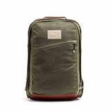 GORUCK olive green waxed canvas backpack with tan accents on white background