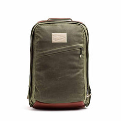 GORUCK olive green waxed canvas backpack with tan accents on white background