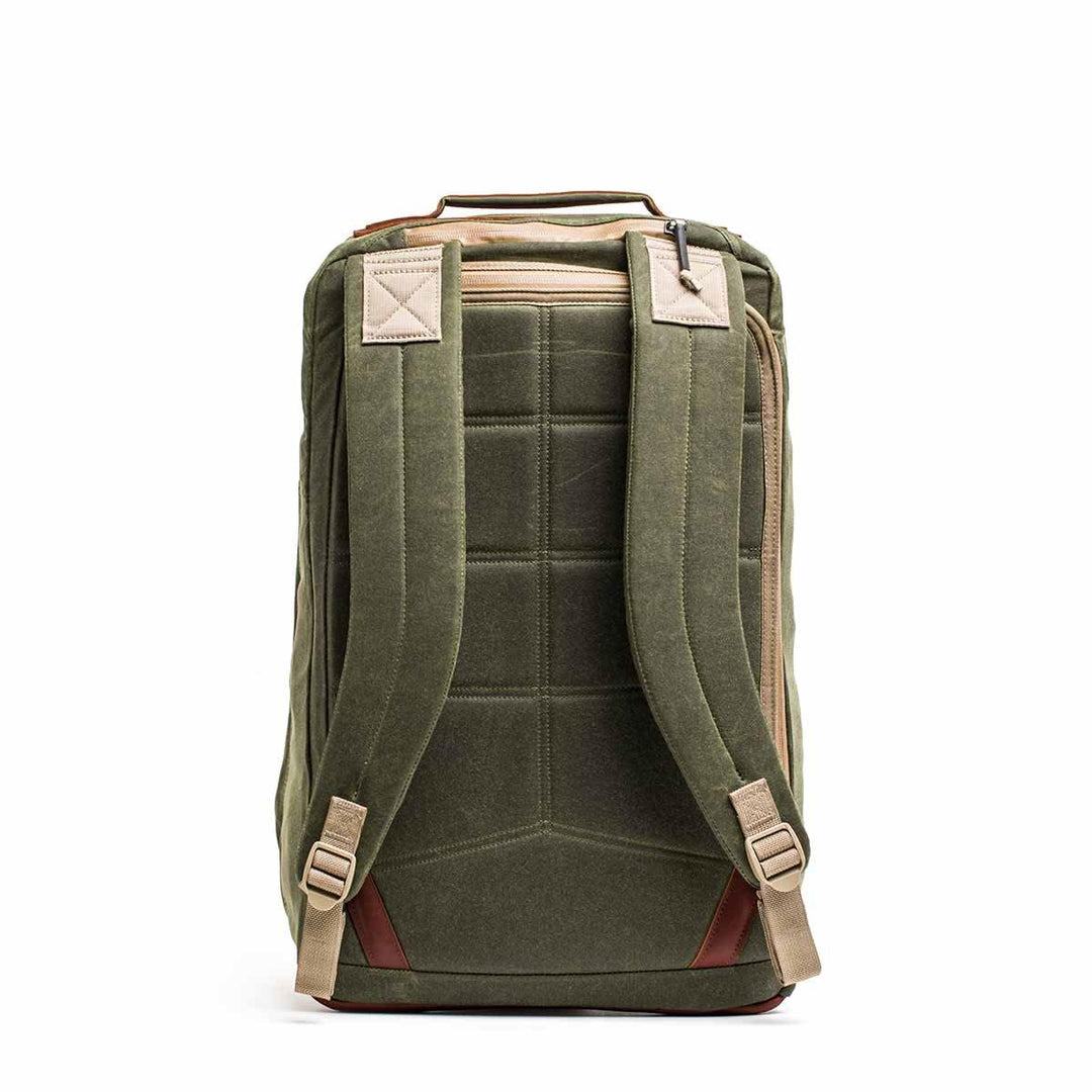 The GORUCK GR2 - Heritage Waxed Canvas backpack features beige straps and a Red Wing Leather handle, displayed from the back on a white background.