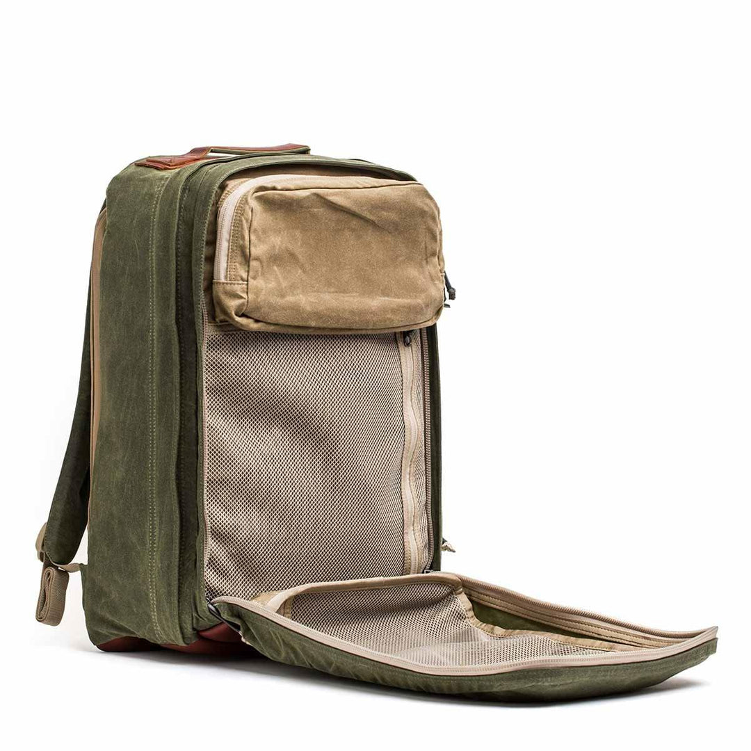 The GORUCK GR2 - Heritage Waxed Canvas backpack features tan accents and mesh inner compartments—a rugged, stylish ruck built for travel and adventure.