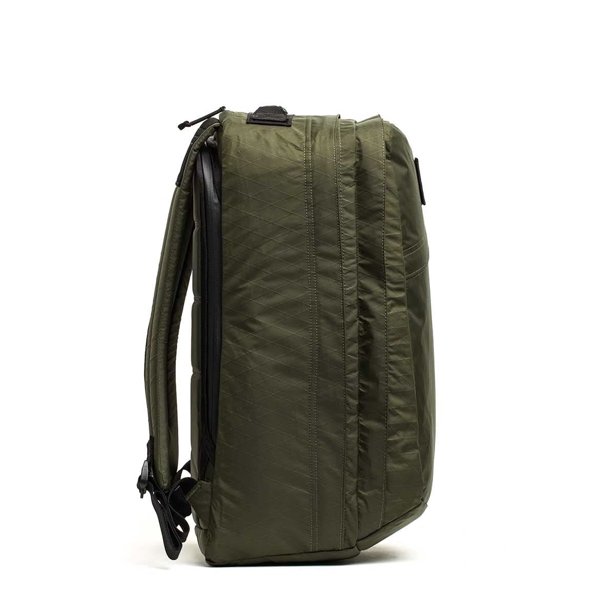 GORUCK GR2 34L rucksack in dark green XPAC, side view highlighting stash pocket and durable build