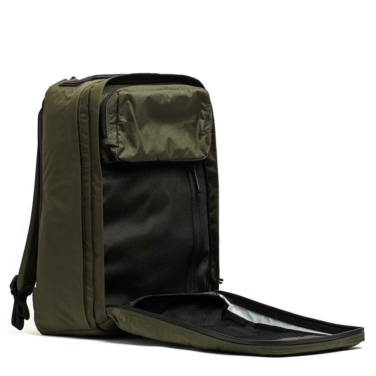 GORUCK dark green 34L rucksack backpack open, showing interior mesh and stash pocket