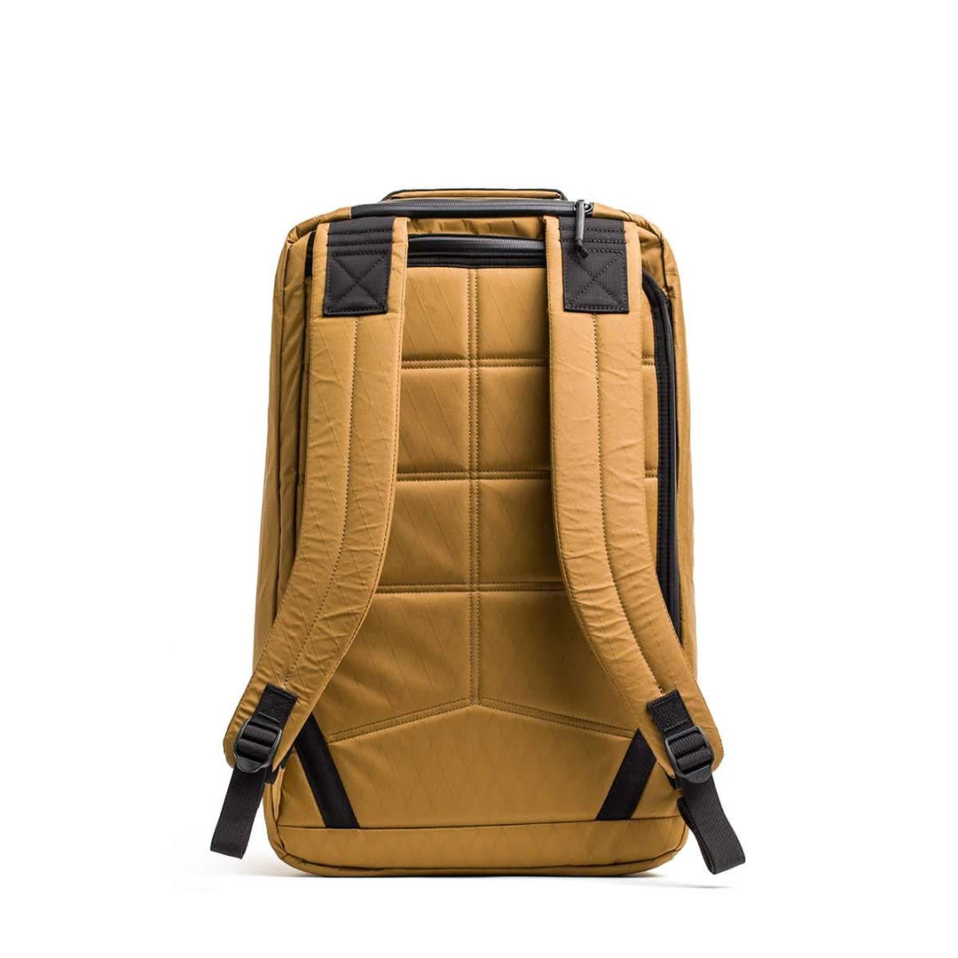 The GORUCK GR2 X-PAC, shown from the back in tan, features padded shoulder straps, rugged stitching, and waterproof protection.