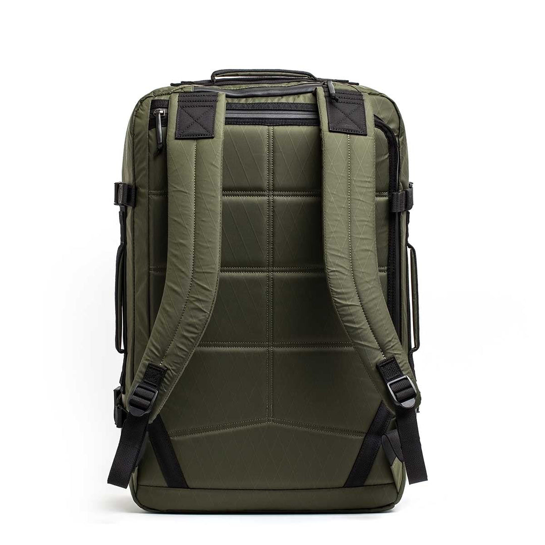 The GR3 - X-PAC is an olive green waterproof carry-on backpack with padded shoulder straps and black accents, displayed from the back on a white background.