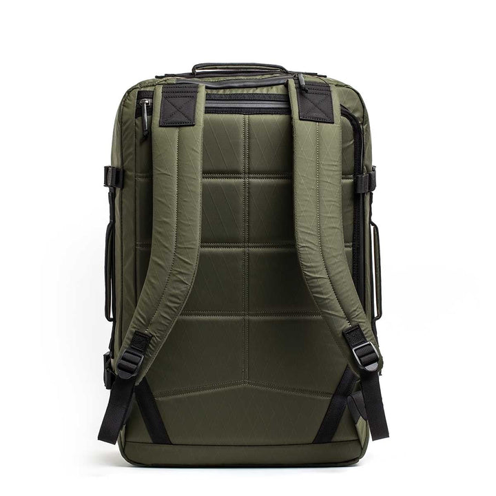The GR3 - X-PAC is an olive green waterproof carry-on backpack with padded shoulder straps and black accents, displayed from the back on a white background.