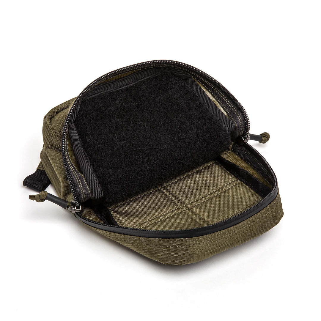 GORUCK Ranger Green tactical pouch with open zipper and interior Velcro panel on white background