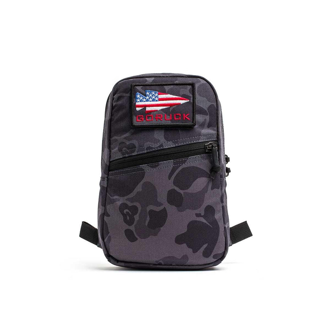 GORUCK black frogskin camo rucking pouch with USA flag patch on white background