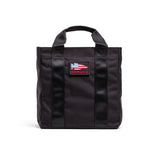 GORUCK black grocery tote bag with American flag patch and sturdy handles on white background