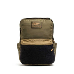 The KR1 2.0 - Kid Ruck by GORUCK is a durable khaki backpack featuring a black front pocket and a tan "GORUCK" patch on the top front, expertly designed to withstand daily adventures and serve as the ultimate indestructible school bag for young explorers.