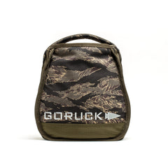 Carry your GORUCK Sand Kettlebell with ease in this small camo-patterned pouch, featuring a convenient handle, front mesh pocket, and the bold "GORUCK" logo on the front. Perfect for transporting your Sand Kettlebells or other home workout equipment wherever your fitness routine takes you.