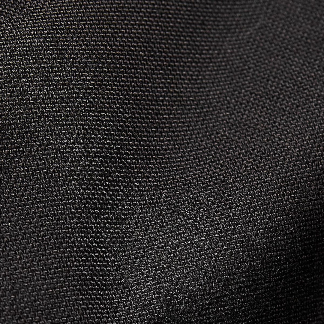 Close-up of the black textured CORDURA fabric by GORUCK, featuring a subtle weave pattern, ideal for crafting a durable 38L Gym Bag - Cordura.