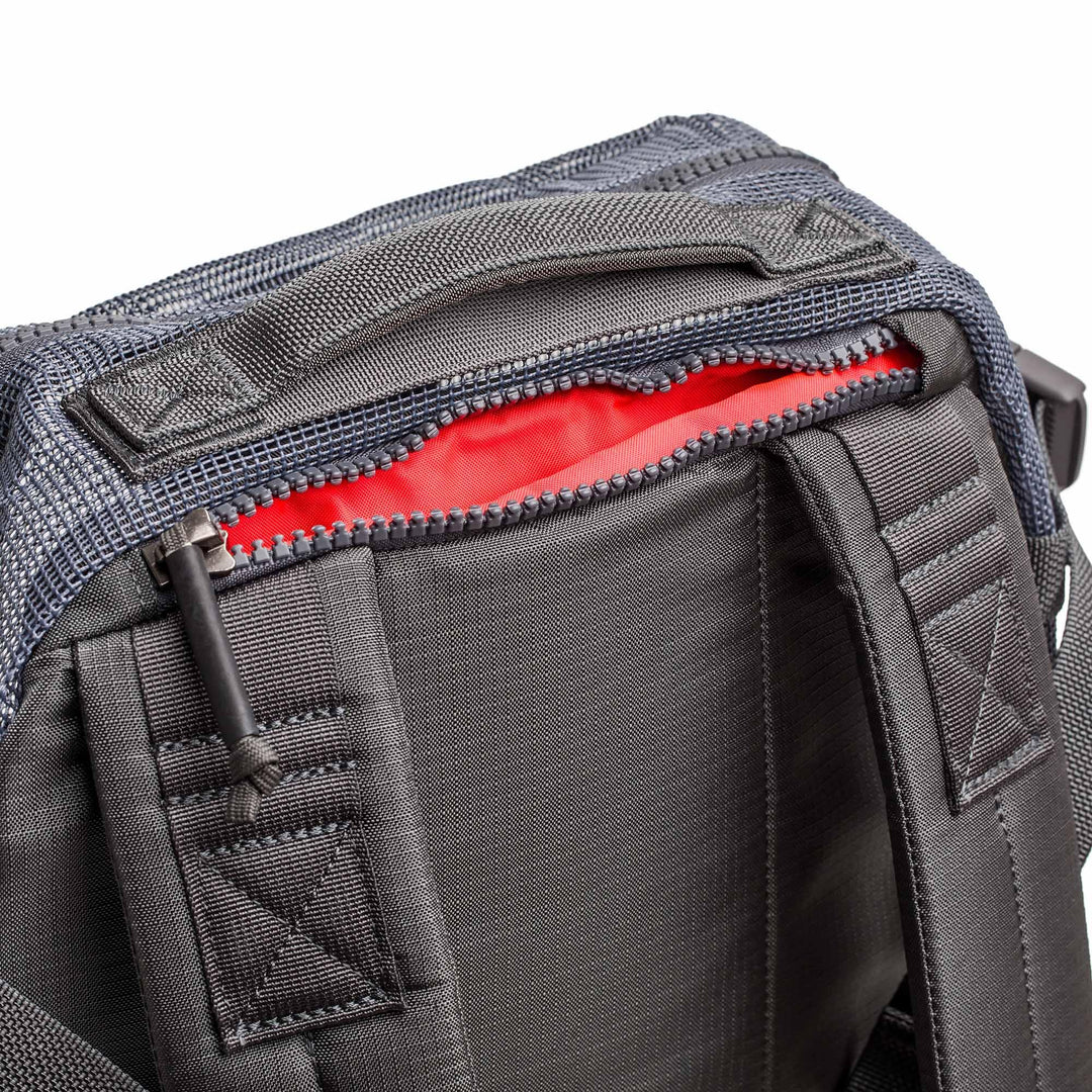 GORUCK Mesh Ruck backpack in Armor Grey with close-up on padded straps and red interior