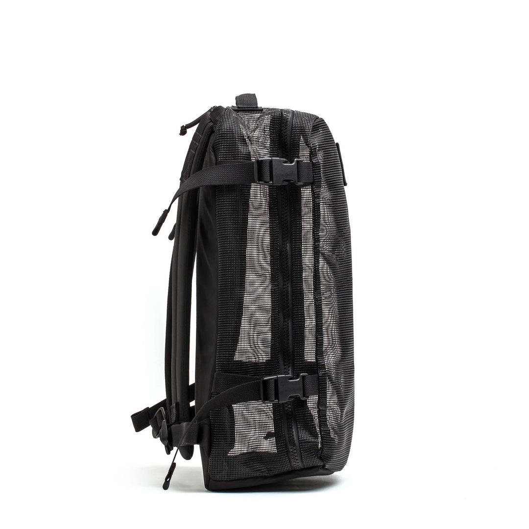 GORUCK black mesh rucking backpack with compression straps, side view on white background