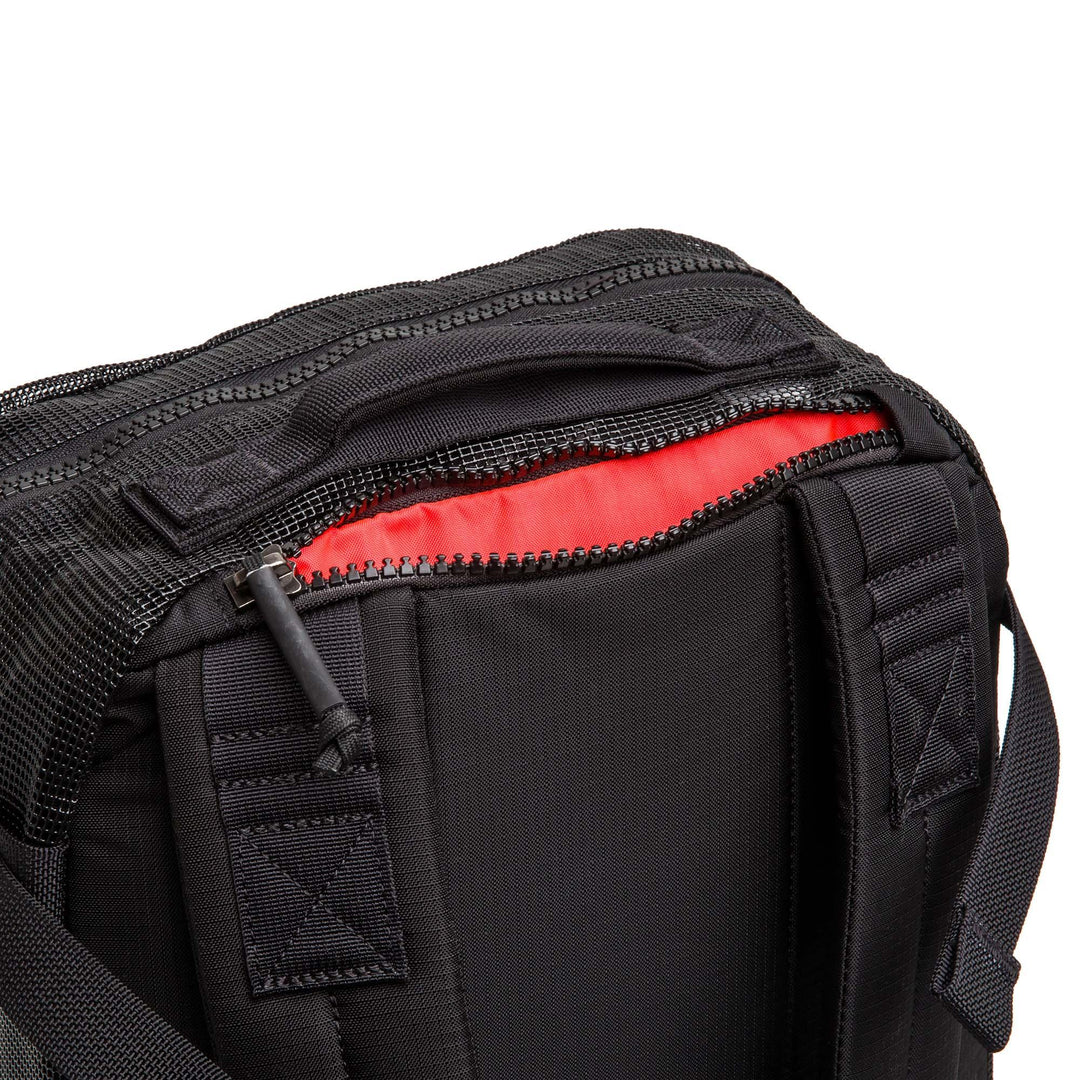 GORUCK black rucking backpack with open zipper and red interior detail