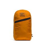 The Packable Bullet Ruck - Ripstop ROBIC® by GORUCK is an orange backpack with a diagonal black stripe and patch, shown on a white background. Made from durable Ripstop ROBIC® nylon for enhanced strength, this lightweight, packable backpack features AquaGuard zippers to keep your gear protected in any weather.