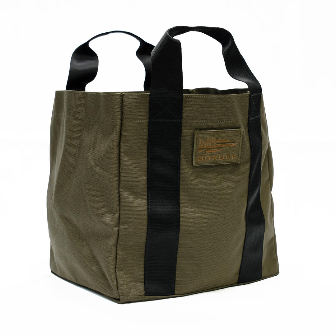 GORUCK olive green tactical tote bag with black handles on white background
