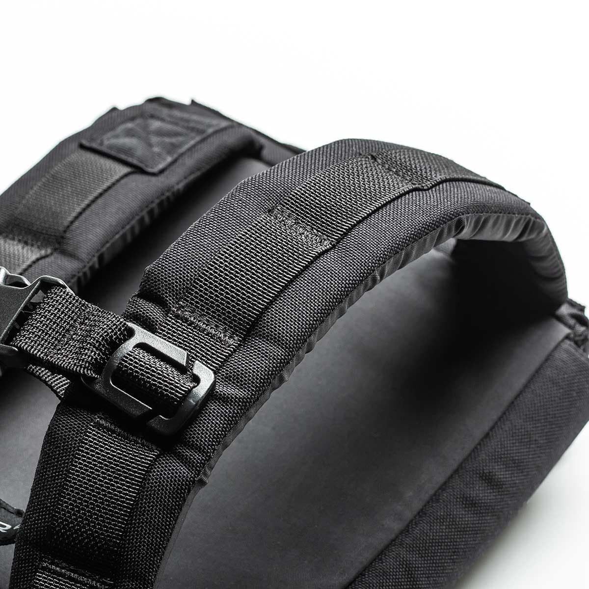 Close-up of GORUCK black rucksack shoulder straps with heavy-duty webbing and buckle