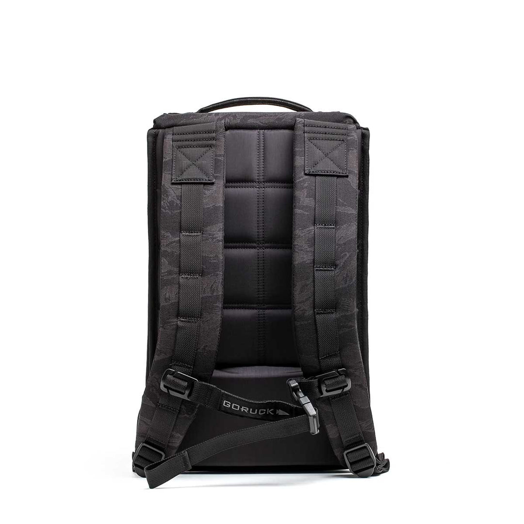 The GORUCK Ruck Plate Carrier 3.0, a black backpack with padded straps and a hip belt for carrying workout equipment, is shown from the back against a white background.