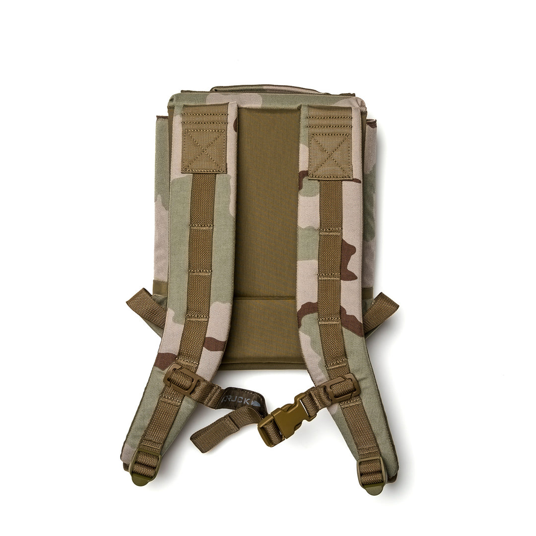 The GORUCK Ruck Plate Carrier 3.0 is a camouflage backpack shown from the back, featuring padded shoulder straps, a chest buckle, and ergonomic lumbar support for comfort.