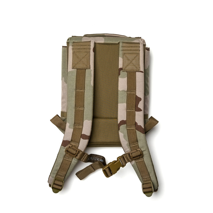 The GORUCK Ruck Plate Carrier 3.0 is a camouflage backpack shown from the back, featuring padded shoulder straps, a chest buckle, and ergonomic lumbar support for comfort.
