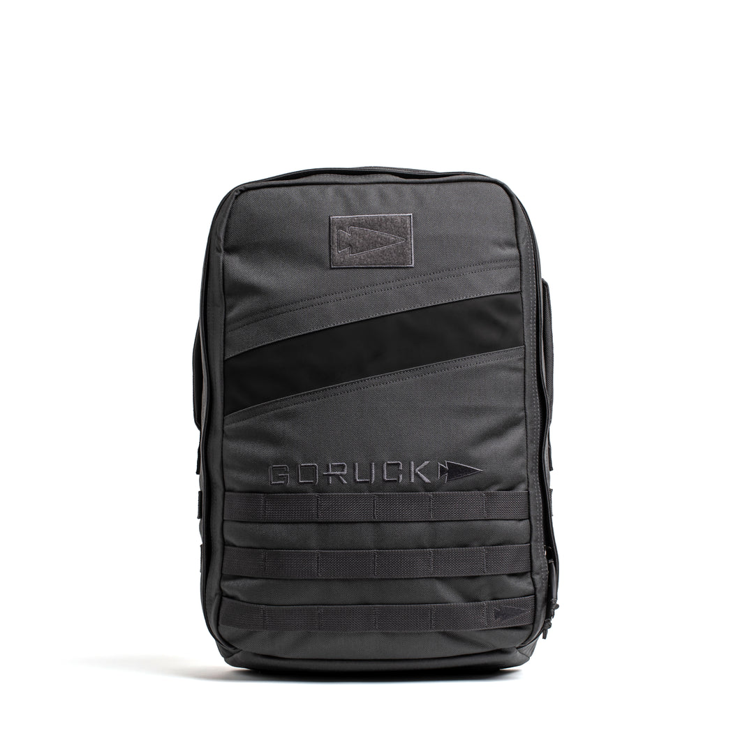 A GORUCK Rucker 4.0 black rucking backpack stands upright on a white background.