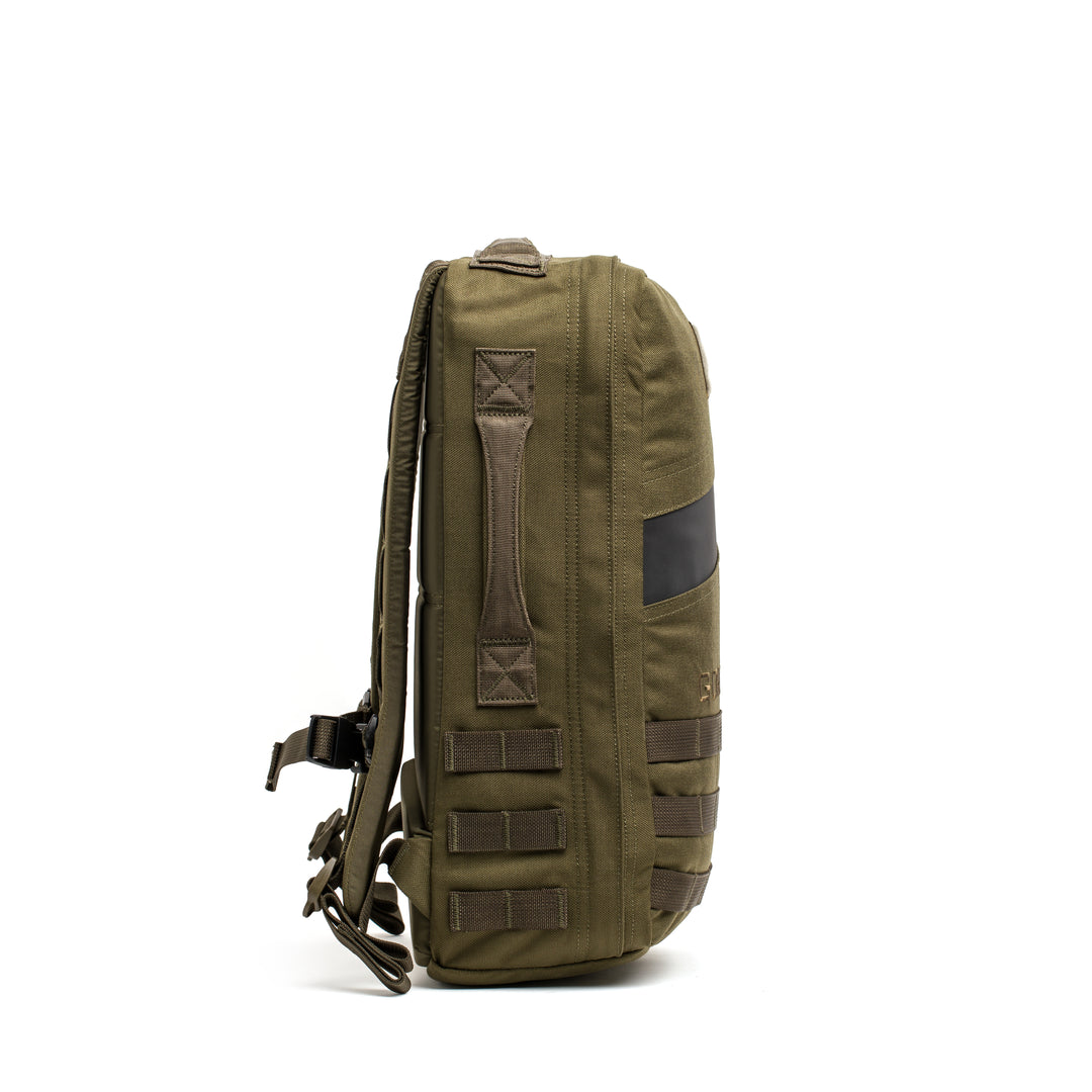 Side view of the GORUCK Rucker 4.0 in olive green with multiple straps and handles, ideal for carrying your rucking gear, shown on a white background.