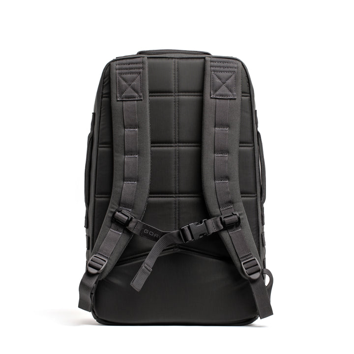 The GORUCK Rucker 4.0 backpack, shown from the back against a white background, features padded straps and a chest buckle.