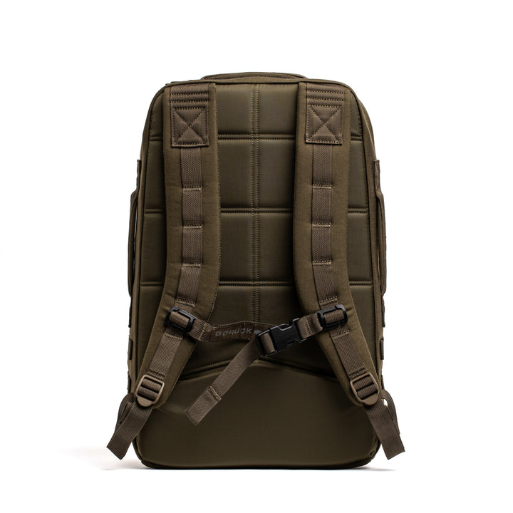 The GORUCK Rucker 4.0 backpack in olive green is shown from the back with padded straps and a chest buckle against a white background.