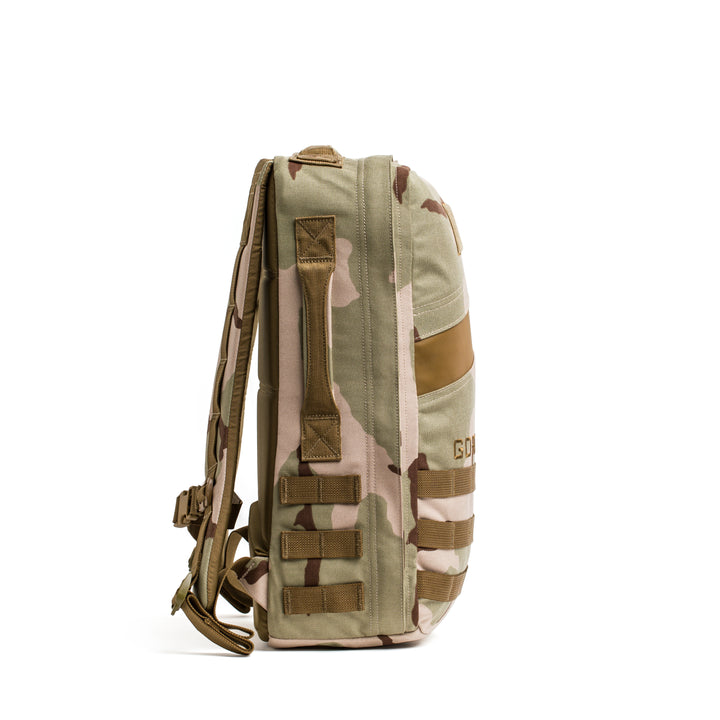 Side view of the GORUCK Rucker 4.0 in tan and brown camo, featuring adjustable straps and MOLLE webbing—ideal for carrying your essential rucking gear.