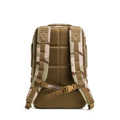 The GORUCK Rucker 4.0 camouflage rucking backpack is shown from the back, highlighting its padded shoulder straps and supportive back panel.