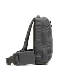 GORUCK Rucker 4.0 15L backpack in armor gray with orange accents, side view on white