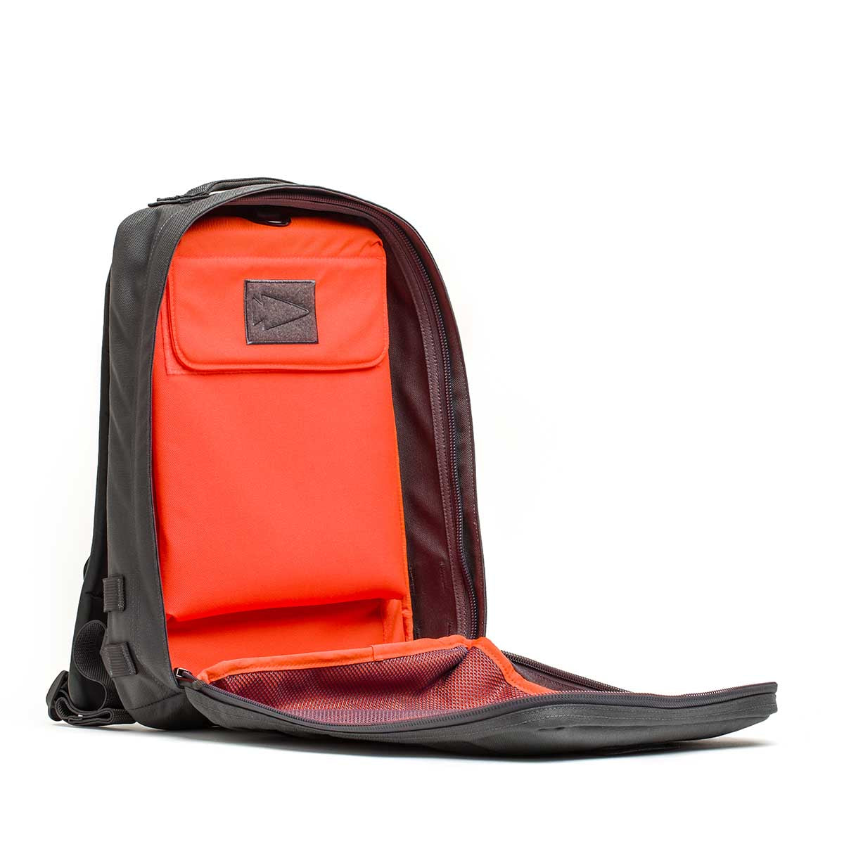 GORUCK Rucker 4.0 15L Armor Gray and Orange backpack open to show interior compartments