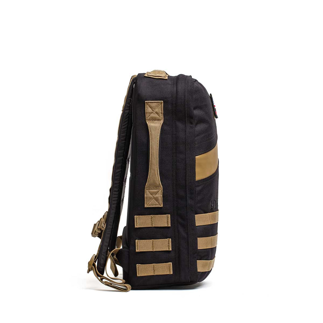 The GORUCK Rucker 4.0 backpack, featuring tan straps and accents, is shown side-on against a white background—perfect for rucking or carrying your Ruck Plate®.