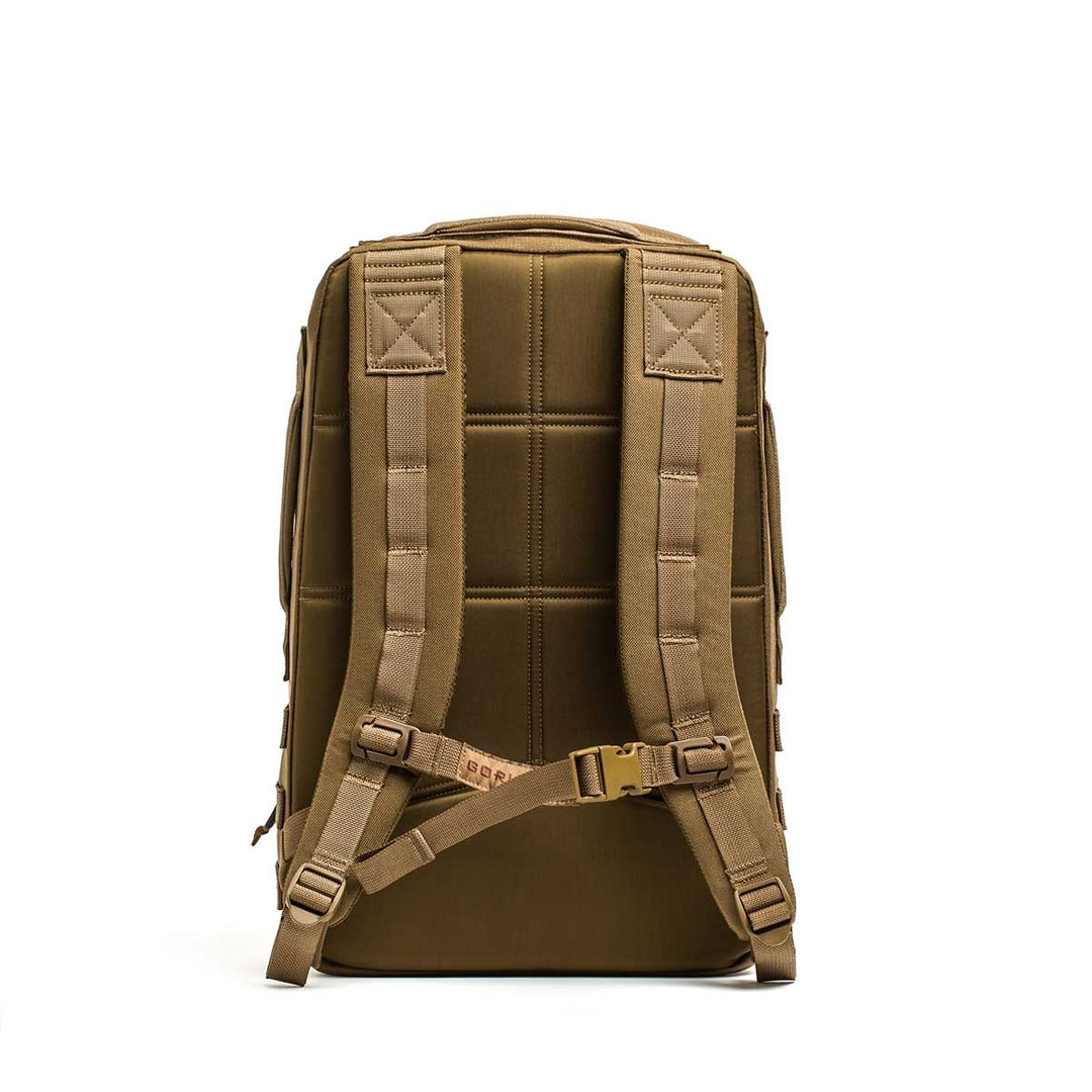 The GORUCK Rucker 4.0 backpack stands upright, back view highlighting padded shoulder straps, buckles, and Ruck Plate compatibility—ideal for rucking adventures.