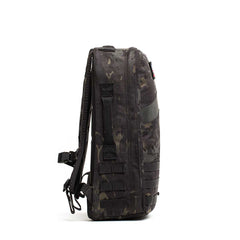 GORUCK Rucker 4.0 25L backpack in black multicam with orange accent, side view