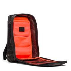 GORUCK black Multicam rucksack open, revealing bright orange interior and gear pockets