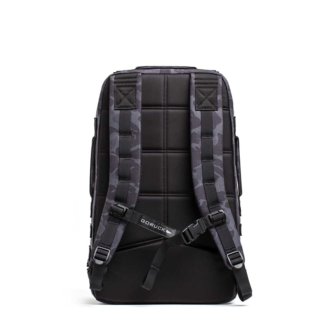 The GORUCK Rucker 4.0, a black rucksack with padded straps and back panel for rucking, is shown from the back against a white background.