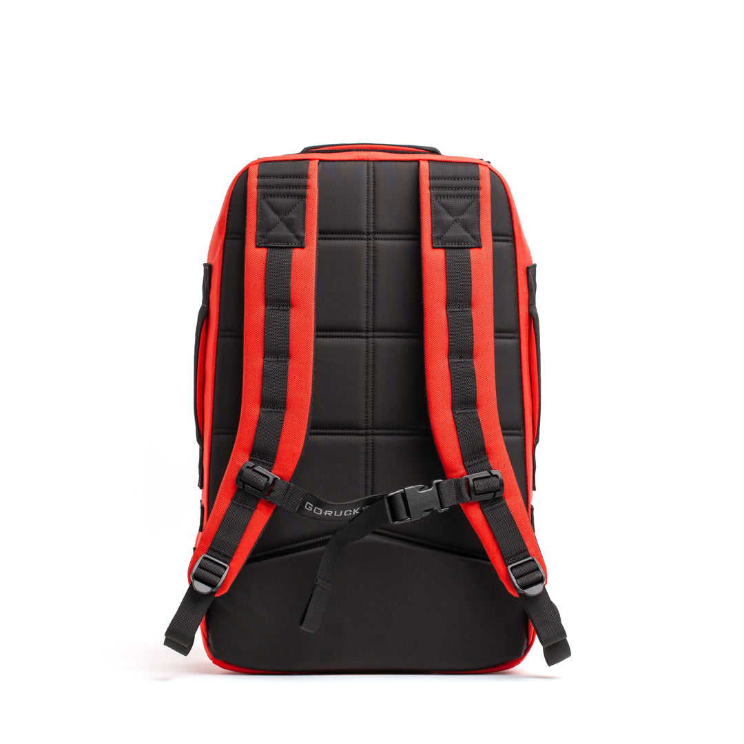 The GORUCK Rucker 4.0 is a black fitness training backpack with red trim, padded back, and adjustable shoulder straps—shown from the back—ideal as a weighted rucksack for workouts.