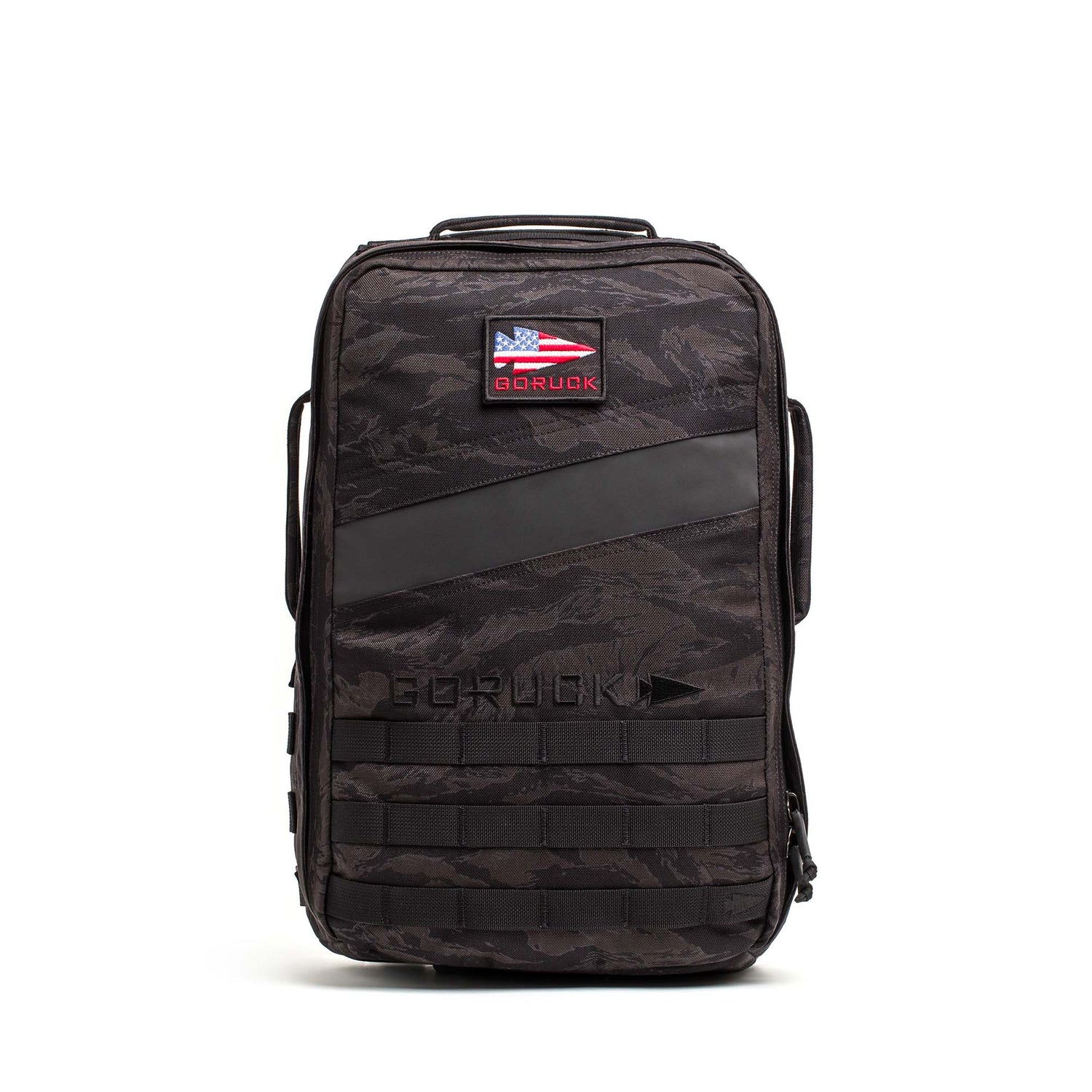 The Rucker 5.0 is a black tactical rucksack featuring an American flag patch, front MOLLE webbing, and built-in lumbar support—ideal for rucking or daily use, shown upright against a white background.