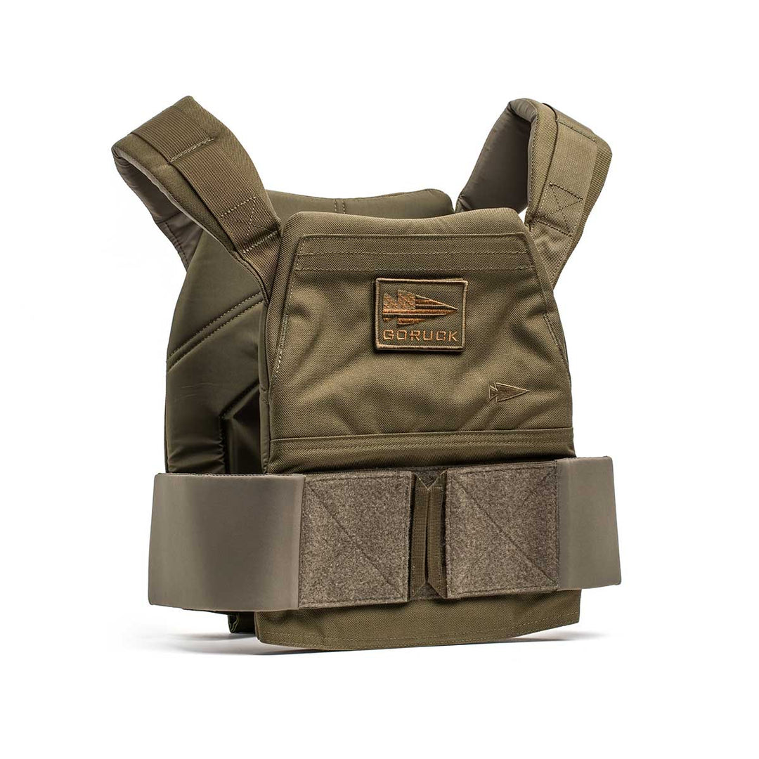 The Rucking Weight Vest in olive green features adjustable shoulder straps, a Velcro waist closure, and a logo patch. Compatible with Curved Ruck Plates, it's ideal for rucking and versatile training sessions.
