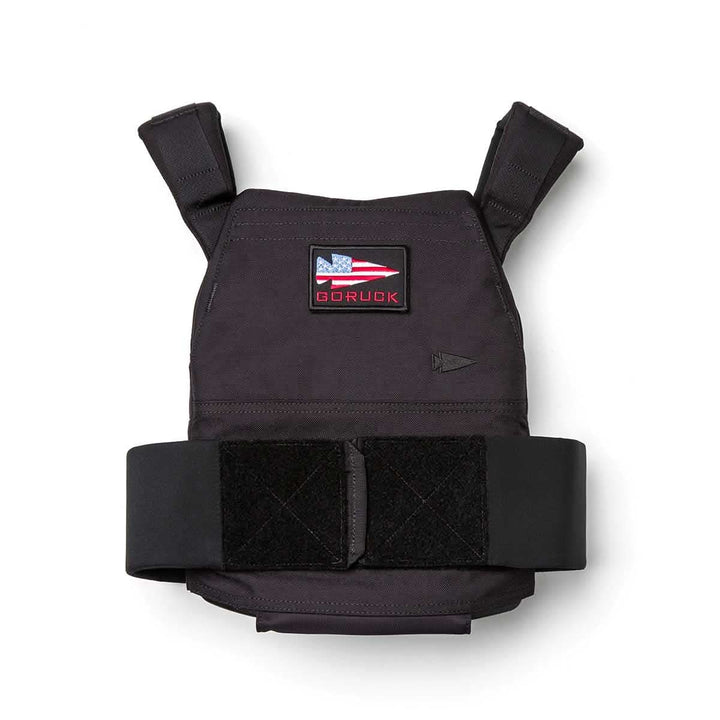 The Rucking Weight Vest features Velcro straps, a patch with a U.S. flag and "GORUCK," ideal for rucking and compatible with Curved Ruck Plates.