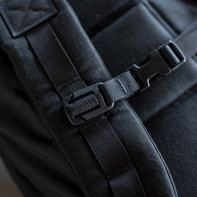 A close-up view of the GORUCK Training Sternum Strap highlights its durable strap and buckle, featuring MOLLE webbing for added gear attachment.
