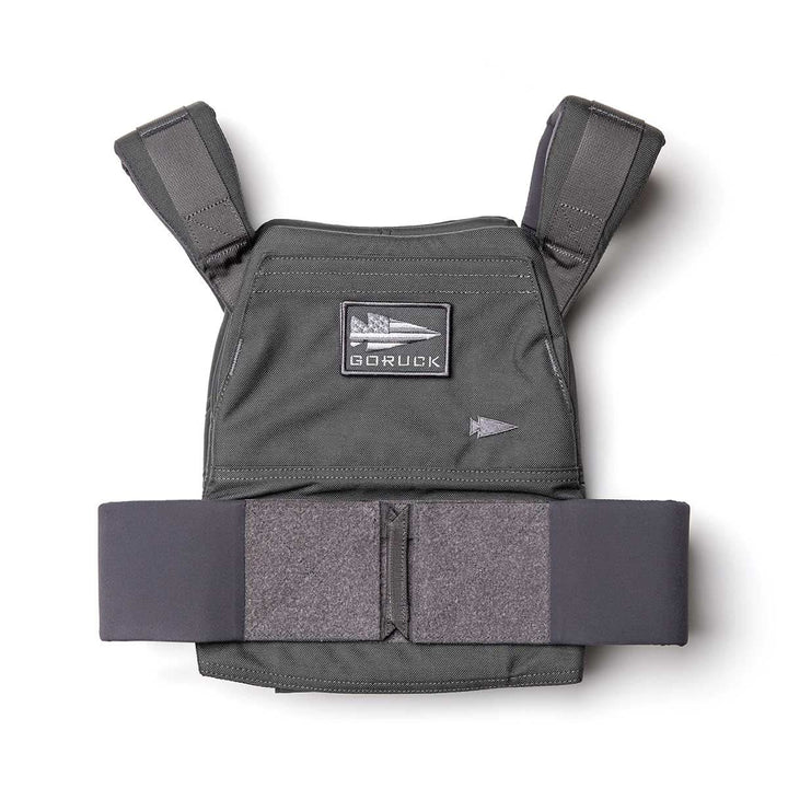 The Rucking Weight Vest is a black tactical vest with padded straps and a GORUCK patch, designed for rucking and compatible with Curved Ruck Plates, shown on a white background.