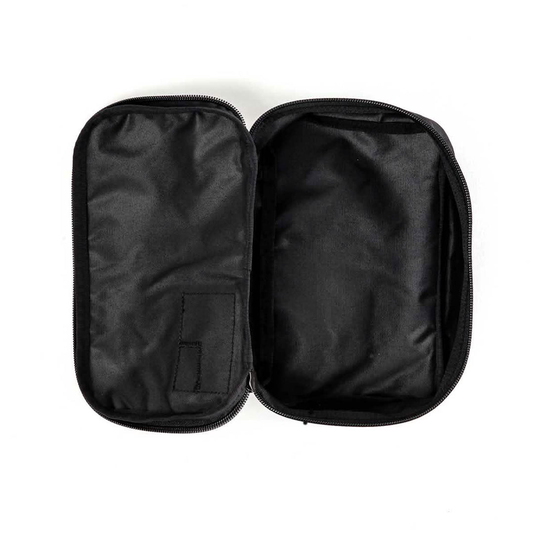 The GORUCK Shadow Pockets, shown empty and open on a white background, are black Cordura zippered pouches ideal for organizing your gear.