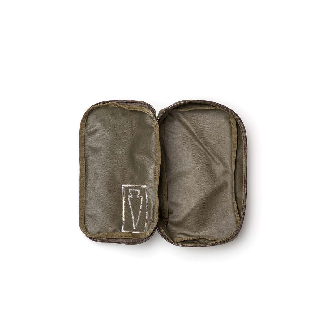 The GORUCK Shadow Pockets are olive green fabric pouches with two compartments, made from rugged 500D Cordura for gear organization; the left side displays a white outlined emblem.