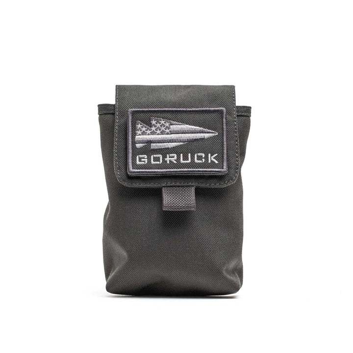 The GORUCK Simple Side Pocket is a black 1000D Cordura pouch with a flap and a bullet-and-flag GORUCK patch—ideal for ruck organization.